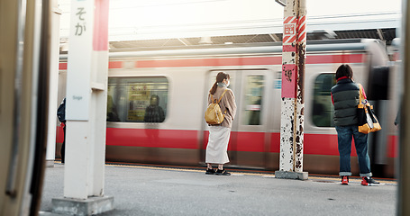 Image showing Motion blur, train with people and travel, journey with commute or tourism, public transportation and sightseeing. Platform, traveller at railway station in Japan and adventure with trip on metro