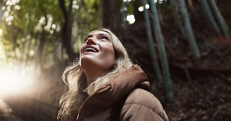 Image showing Nature, hiking and happy woman travel in forest on vacation, holiday or tourism in Japan. Smile, woods and an excited person outdoor in environment, park and explore on adventure for freedom in Tokyo