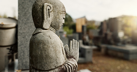 Image showing Japan, prayer hands and buddhist stone statue at graveyard for spiritual religion in Tokyo. Jizo, cemetery and gravestone for memorial service, culture and traditional tombstone for worship or zen