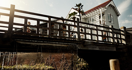 Image showing House, bridge and sunshine with trees in Japan of building, structure or Japanese architecture. Outdoor home design or eco friendly environment in Tokyo with natural greenery or scenery on sunny day