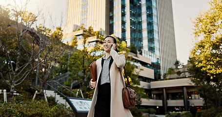 Image showing City, phone call and woman with business, conversation and walking with network, digital app or communication. Japan, person or worker with a smartphone, connection and speaking with contact or smile