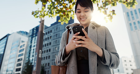 Image showing City, business and woman with cellphone, smile and typing with connection, online news and digital app. Japan, person or employee with smartphone, social media or reading a blog with contact or email