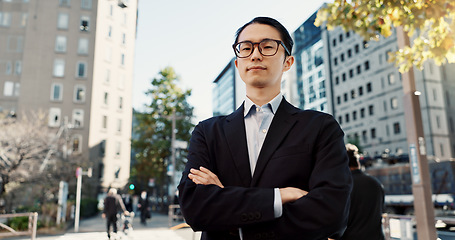 Image showing Businessman, portrait and professional in city street as broker in financial market, confident or Tokyo. Male person, face and corporate career travel at business building or Japan, pride or sidewalk