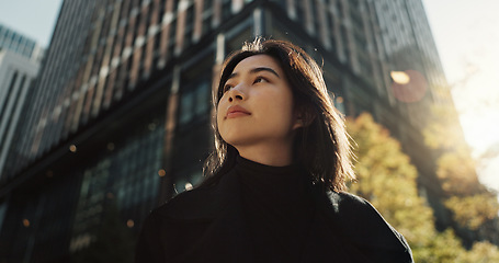 Image showing Walking, building and Japanese woman in city for tourist sightseeing in the street on weekend trip. Travel, adventure and bottom view of young female person commuting in road of town in Kyoto Japan.