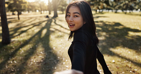 Image showing Japanese woman, pov and hand on walk, portrait and smile in park to show path, nature and trees. Girl, person and outdoor with grass, lawn and plants for freedom, adventure or travel journey in Tokyo