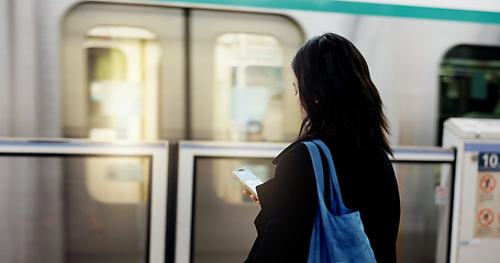 Image showing Woman, train travel and phone with back, bag and journey on metro railway with typing for web chat. Girl, person and smartphone with click, contact or social network app on public transport system