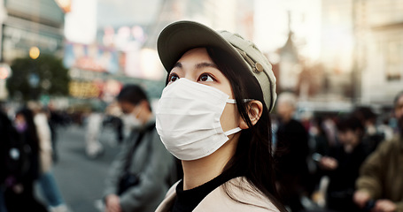 Image showing Virus, Japan and woman in travel with face mask for health and on city background. Compliance, safety for japanese female person outdoors with facial protection for corona or covid pandemic on street
