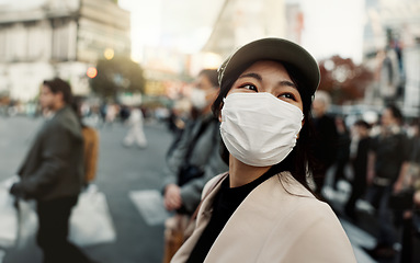 Image showing City, japan and woman in travel with face mask for health and walking in town. Covid compliance, safety for wellness and female person outdoors with facial protection for corona virus pandemic