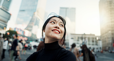 Image showing Walking, happy and Japanese woman in the city for tourist sightseeing in the street on weekend trip. Smile, adventure and young female person commuting for travel in road of urban town in Kyoto Japan