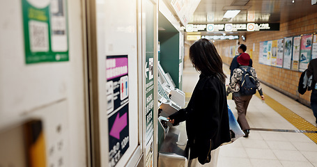 Image showing Woman, ATM card and money in subway for travel, journey or vacation with choice for financial freedom. Girl, person and banking with machine for cash, budget or decision with bag on holiday in Tokyo