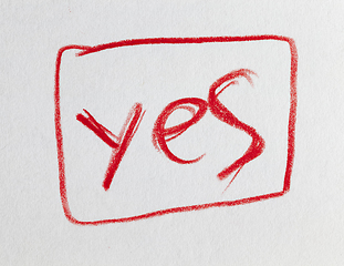 Image showing word Yes drawn in red pencil