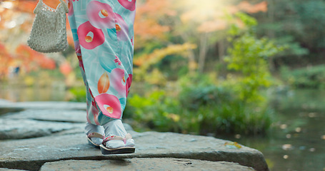 Image showing Walking, lake or legs of woman in nature for journey on holiday vacation for freedom or wellness. Park, travel or feet of Japanese person on rocks for health, peace and inspiration to relax in forest