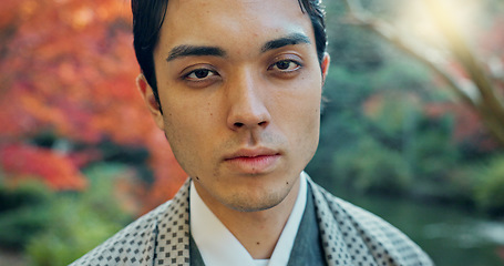 Image showing Asian, man in garden in Japan and face, nature with mindfulness outdoor and peace with culture. Traditional clothes, fresh air and travel with local or tourist in portrait in a park for zen and calm