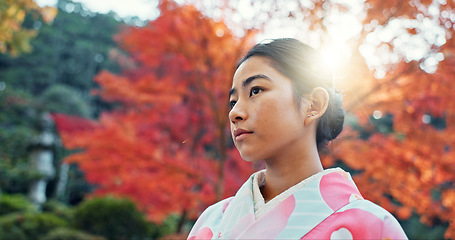 Image showing Woman in park, Asian and peace, thinking about life with reflection and tranquility in traditional clothes. Travel, Japanese garden and nature for fresh air, inspiration or insight with floral kimono