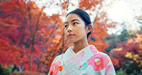 Image showing Woman in park, Asian and peace, thinking about life with reflection and tranquility in traditional clothes. Travel, Japanese garden and nature for fresh air, inspiration or insight with floral kimono