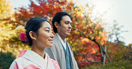 Image showing Asian couple, walking in garden and sunshine, peace and thinking about life, reflection and date in nature. Travel, people together in Japanese park for fresh air and calm with love, care and trust