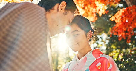 Image showing Couple, forehead touch and sunshine with love in park, Japanese people together on date with love and affection. Lens flare, summer and man with woman outdoor, commitment and loyalty with peace