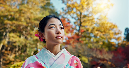 Image showing Woman in garden, Asian and calm with fan, thinking about life with reflection and tranquility in traditional clothes. Peace Japanese park and nature for fresh air with inspiration or insight