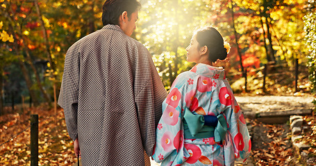 Image showing Man, woman and walking in forest with date in nature park, back of couple in traditional clothes in Japan. Love, care and together outdoor, peace and calm in garden with commitment, partner and trust