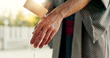 Image showing Shinto temple, person and washing hands at fountain with container for cleaning, faith and worship. Religion, mindfulness and purification ritual to stop evil, bacteria and peace at shrine in Tokyo