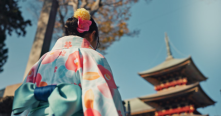 Image showing Woman, shinto temple and back with traditional clothes in culture, building or religion with vision for zen balance. Japanese girl, idea and buddhism in faith, mindfulness or walk on journey in Kyoto