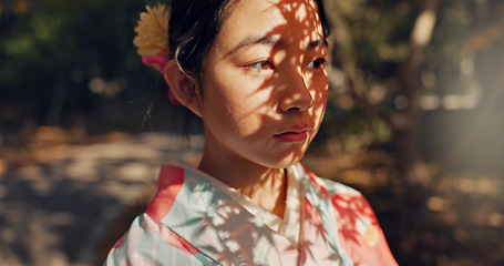 Image showing Face, thinking or Asian woman in nature for journey on holiday, vacation for freedom or wellness. Girl, travel or Japanese female person with ideas for calm, peace or inspiration to relax in park