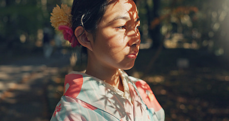 Image showing Face, thinking or Asian woman in nature for journey on holiday, vacation for freedom or wellness. Girl, travel or Japanese female person with ideas for calm, peace or inspiration to relax in park