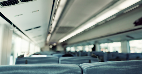 Image showing Empty train interior, seats and transport with moving, window and vehicle with public infrastructure. Locomotive, railway travel and chair for passenger commute, services and carriage in Tokyo