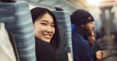 Image showing Smile, face and young Asian woman on a train for public transportation to work in the city. Happy, portrait and female person with positive, confident and good attitude for commuting to office.