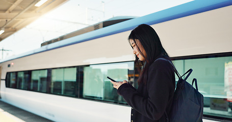 Image showing Woman, phone and outdoor, city or train for travel information, schedule or social media in Japan. Asian student thinking with backpack and mobile search for location, metro or subway transportation