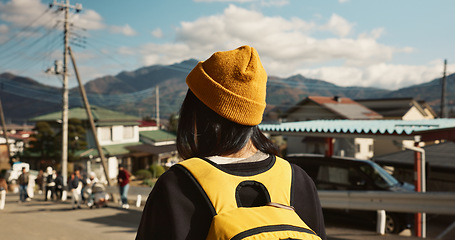 Image showing Asian, woman at train station and travel, back view on commute or holiday and freedom outdoor. Railway, walking on platform and transportation, journey for adventure in China and weekend trip