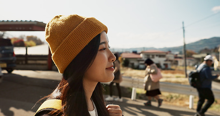 Image showing Asian, woman at train station and travel, commute or holiday and freedom outdoor with profile. Railway, walking on platform and transportation, journey for adventure in China and weekend trip