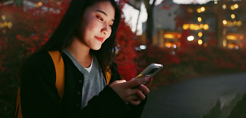 Image showing Happy asian woman, phone and night for communication, social media or outdoor networking in city. Female person relax on mobile smartphone in late evening for online chatting in urban town of Japan