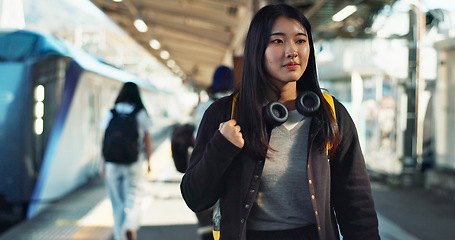 Image showing Asian, woman at train station for travel, commute or holiday with smile on face and freedom outdoor. Railway, walking on platform and transportation, journey for adventure in China with happiness