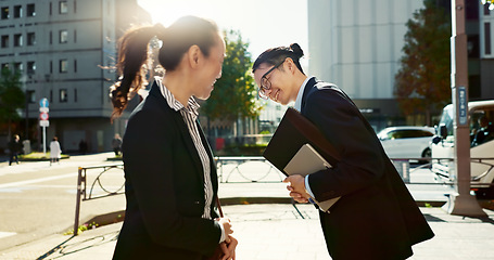 Image showing Asian people in city, professional and bow for greeting with conversation, travel and commute to work in morning. Business man, woman and hello in Tokyo, journey and urban street with communication