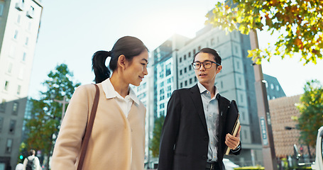 Image showing Walking, conversation and business people in the city talking for communication or bonding. Smile, discussion and professional Asian colleagues speaking and laughing together commuting in town.