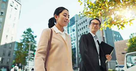 Image showing Walking, conversation and business people in the city talking for communication or bonding. Smile, discussion and professional Asian colleagues speaking and laughing together commuting in town.