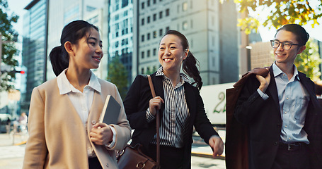 Image showing Asian, business people in city and travel, talking and walking with commute to work, conversation and bonding. Journey on urban street, friends chat with communication and happy commuting together