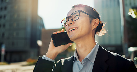 Image showing Asian man, phone call and laughing in city for funny joke, conversation or outdoor networking. Happy businessman smile and talking on mobile smartphone for fun business discussion in an urban town