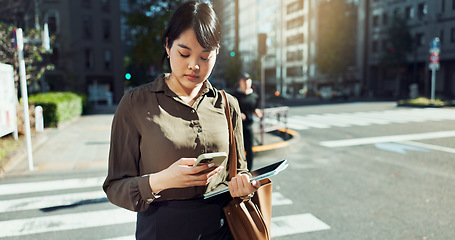 Image showing Phone, walking and business woman in the city networking on social media, mobile app or internet. Technology, street and professional Asian female person with cellphone commuting in street in town.