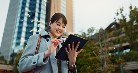 Image showing Happy asian woman, tablet and city for social media, research or communication in outdoor networking. Business female person smile on technology in online search, chatting or texting in an urban town