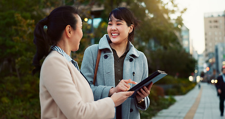 Image showing Asian woman, tablet and team on sidewalk in city for communication, research or social media. Business people smile with technology for online search, chat or networking on pavement in an urban town