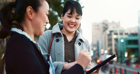 Image showing Asian woman, tablet and team in city of Japan for communication, research or social media together. Business people smile on technology for online search, chat or networking on sidewalk in urban town