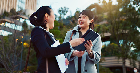 Image showing Asian woman, tablet and team in city of Japan for communication, research or social media together. Business people smile on technology for online search, chat or networking on sidewalk in urban town