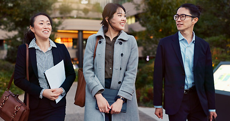 Image showing Walking, conversation and business people in the city talking for communication or bonding. Smile, discussion and professional Asian colleagues speaking and laughing together commuting in town.