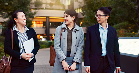 Image showing Walking, conversation and business people in the city talking for communication or bonding. Smile, discussion and professional Asian colleagues speaking and laughing together commuting in town.