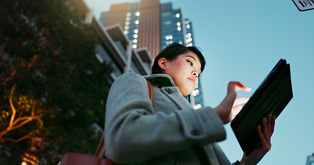 Image showing Asian woman, tablet and city for communication, research or social media by building in Japan. Female person or employee on technology for online search, chat or outdoor networking in an urban town