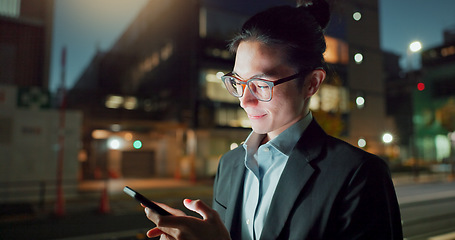 Image showing Phone, night and Asian businessman in the city networking on social media, mobile app or internet. Technology, smile and young professional male person with cellphone for research in town at night.