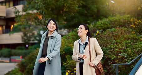 Image showing Walking, conversation and business women in the city talking for communication or bonding. Smile, discussion and professional Asian female people speaking and laughing together commuting in town.