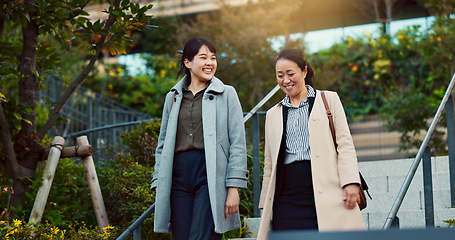 Image showing Walking, conversation and business women in the city talking for communication or bonding. Smile, discussion and professional Asian female people speaking and laughing together commuting in town.